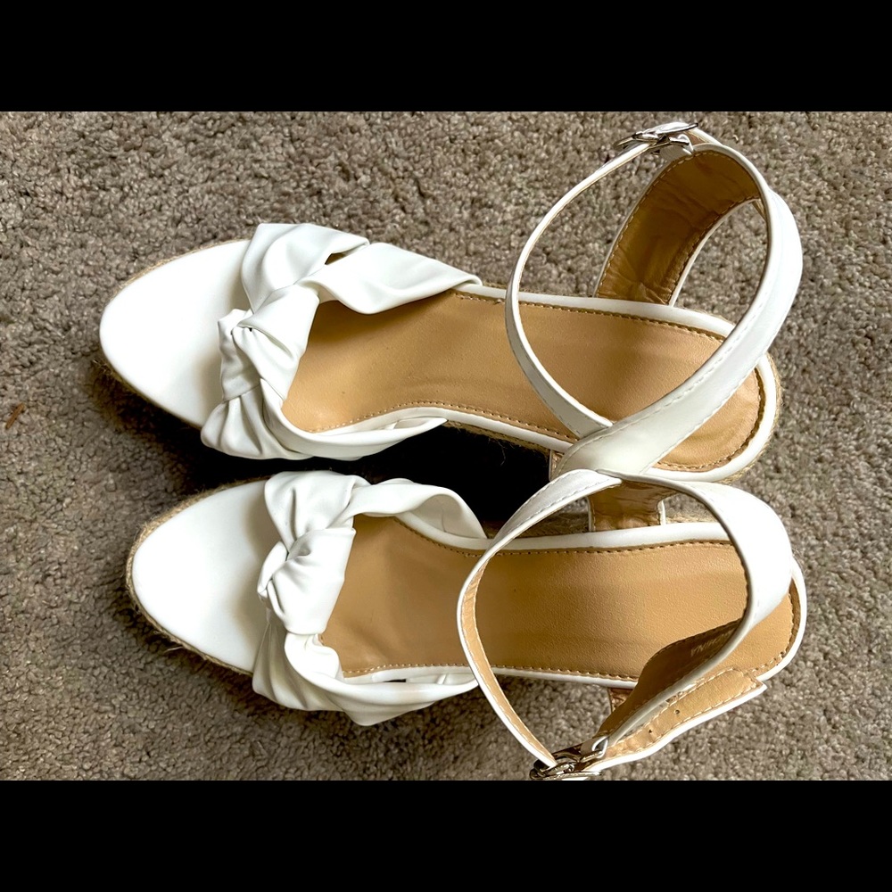 White bow tied wedged heels! Size 8 1/2 or 9 fits. Never worn.